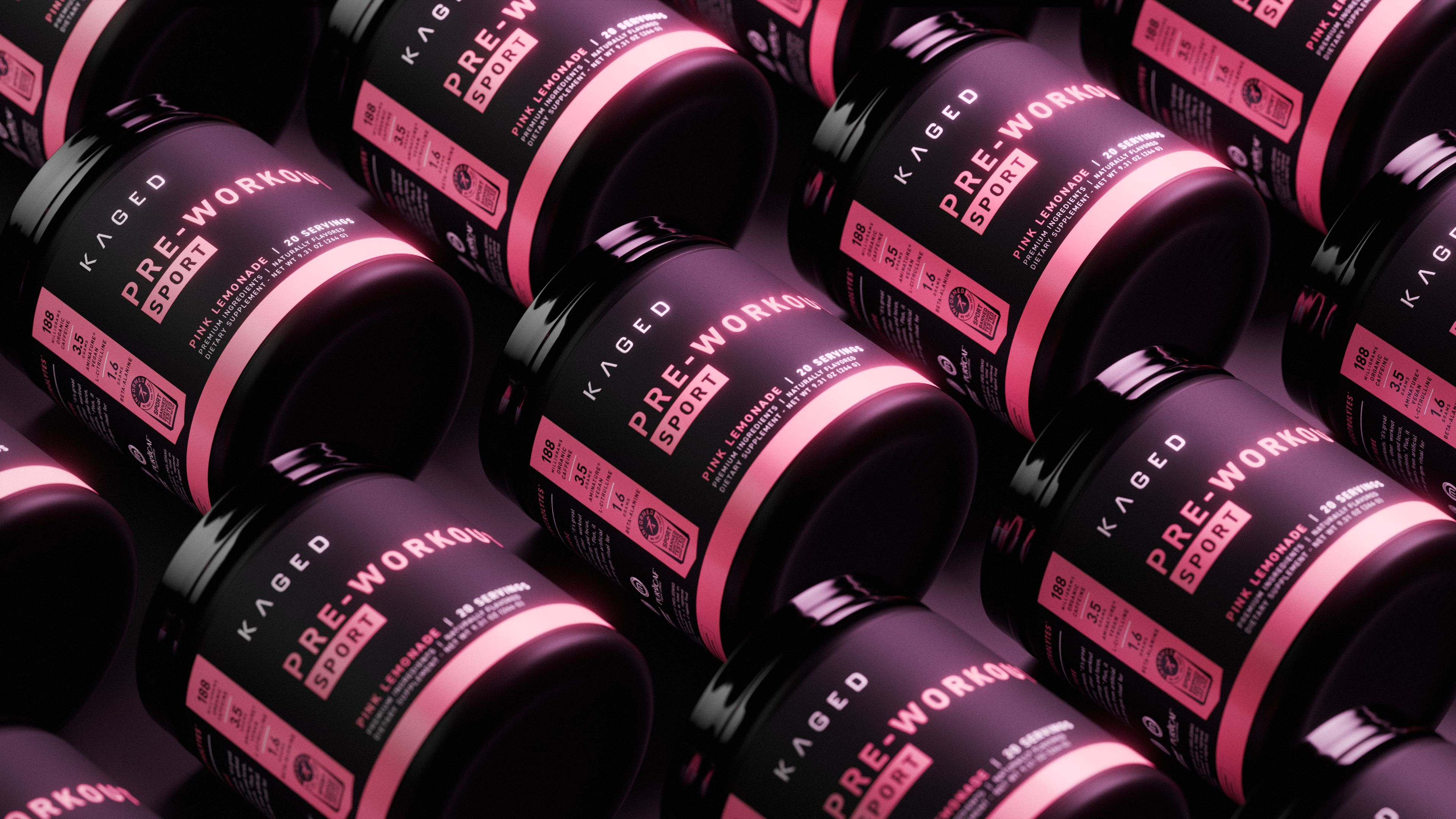 Angled close-up of KAGED Pre-Workout Sport tubs with pink labels, showing pre-workout supplement packaging on dark background
