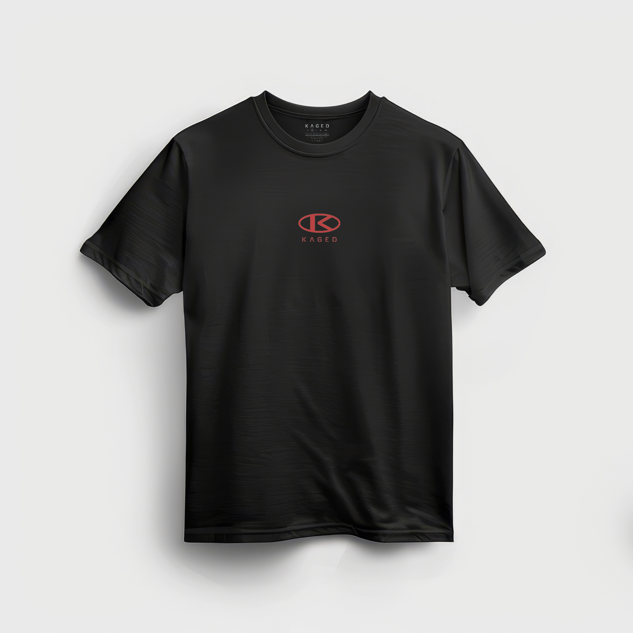 Front view of black Circle Tee crewneck showcasing small red KAGED circle logo centered on chest on gray background #color_black