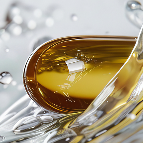 Close-up of omega-3 fish gelatin softgel showcasing glossy, oil-filled translucent capsule on a spoon with reflective droplets