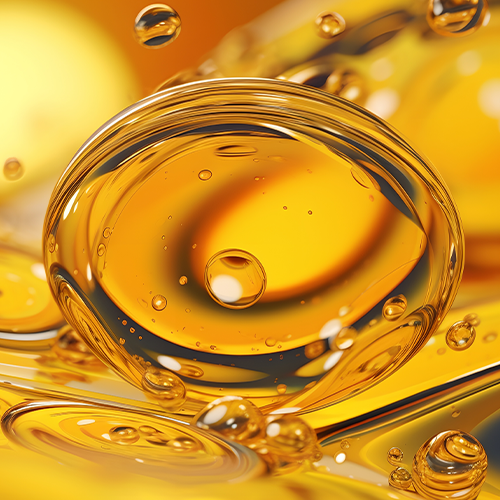 Close-up of triglyceride fish oil droplet showcasing golden high-purity omega-3 oil on white background
