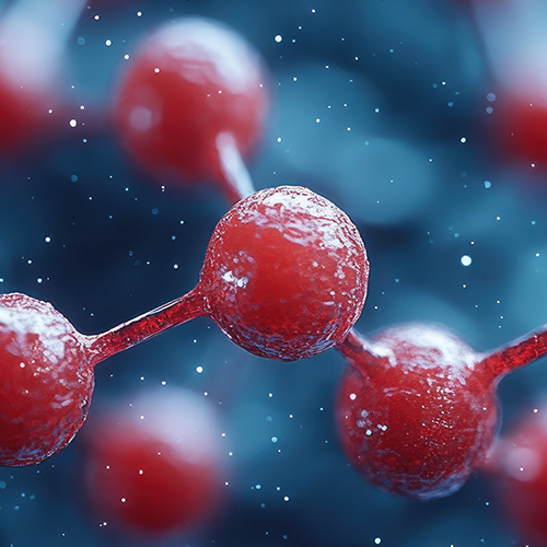 Close-up of red molecular model representing Carnipure L-Carnitine L-Tartrate on a dark blue background
